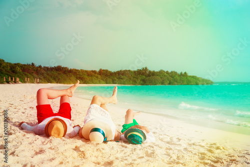 Fototapeta Naklejka Na Ścianę i Meble -  happy family with child relax having fun on beach