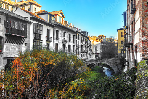 One of the charming street situated on riverside of river Darro in Granada, Andalusia photo