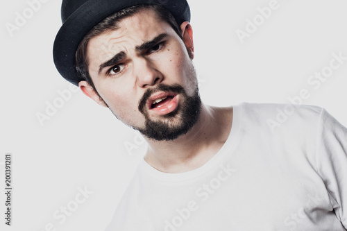 Portrait of surprised bearded man  against white  background © Raisa Kanareva