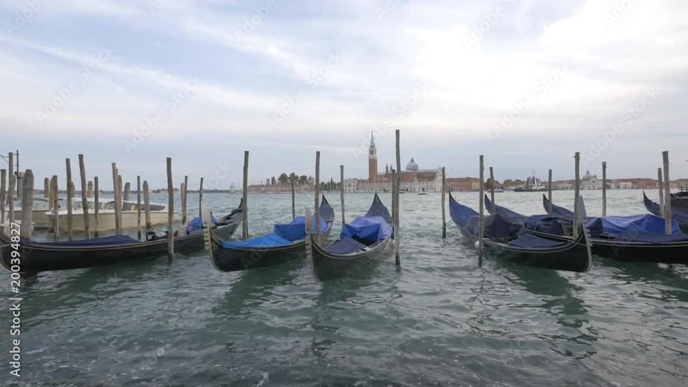 Gondolas moored in the Venetian Lagoon Gondolas moored in the Venetian Lagoon