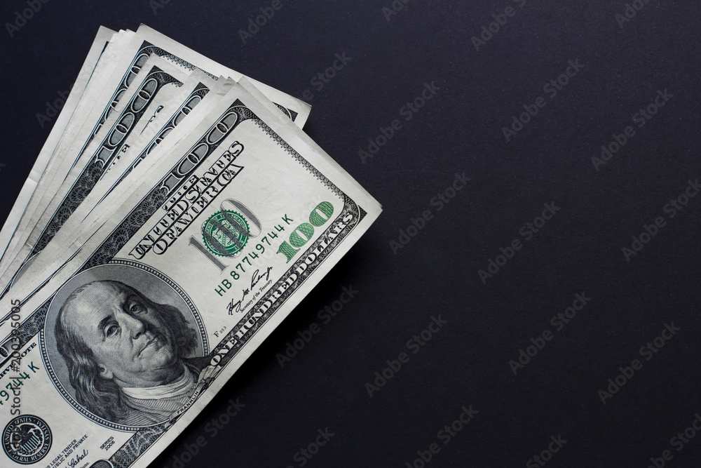 One hungret dollar bills on black background. Cope space One hungret dollar bills on black background. Cope space