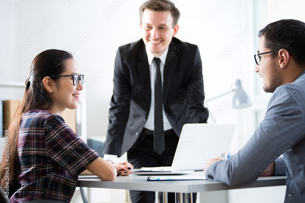 Fototapeta premium Businessmen recruit a young employee