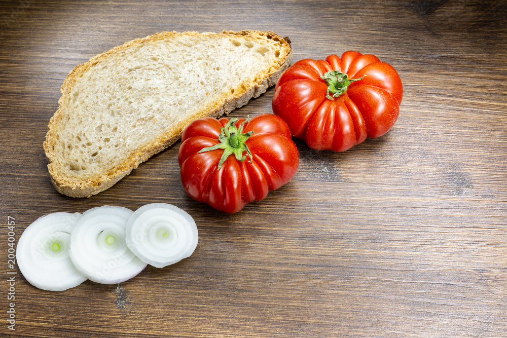 A classic and healthy combination, bread, tomato and onion have a fundamental part in the Mediterranean diet. A classic and healthy combination, bread, tomato and onion have a fundamental part in the Mediterranean diet.