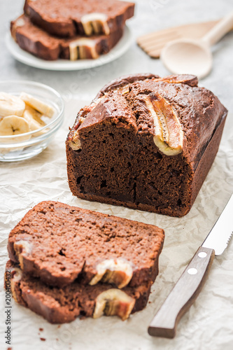 Classic banana bread on light concrete background. Selective focus ,space for text.