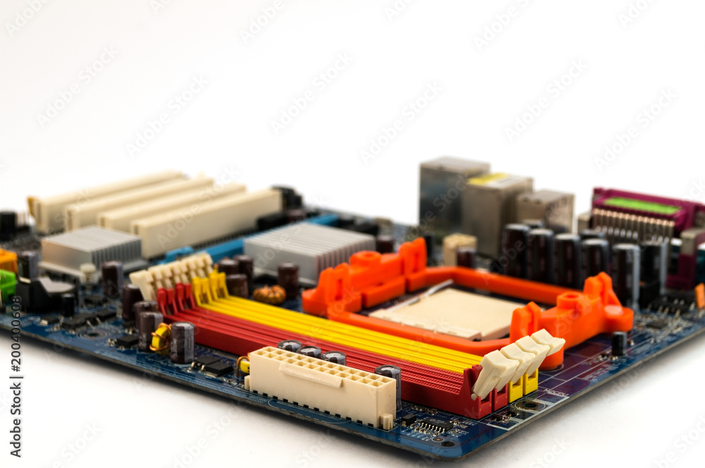 Motherboard for computer, located at an angle with a blurry background on a white background. Motherboard for computer, located at an angle with a blurry background on a white background.