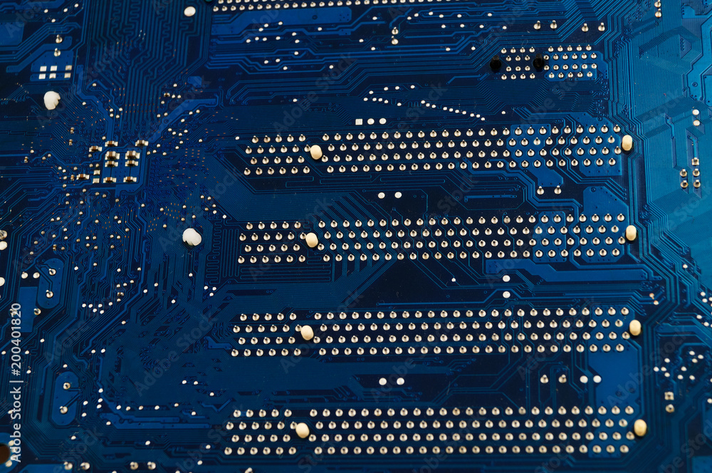 Contacts on the back of the motherboard - the main computer device with ...