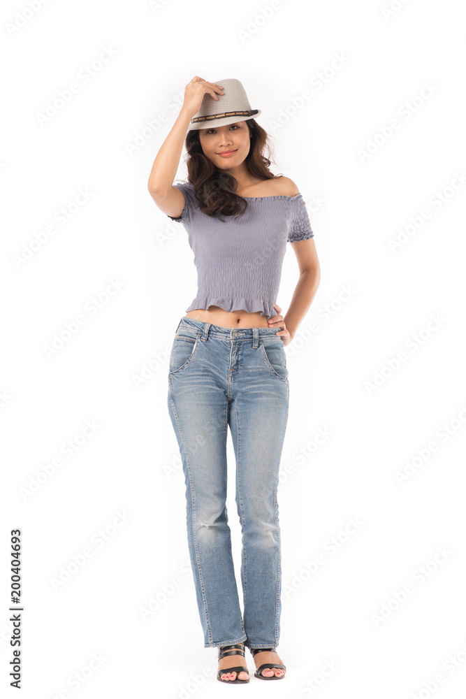 Portrait of beautiful Asian girl wearing jeans and hat on white background Portrait of beautiful Asian girl wearing jeans and hat on white background