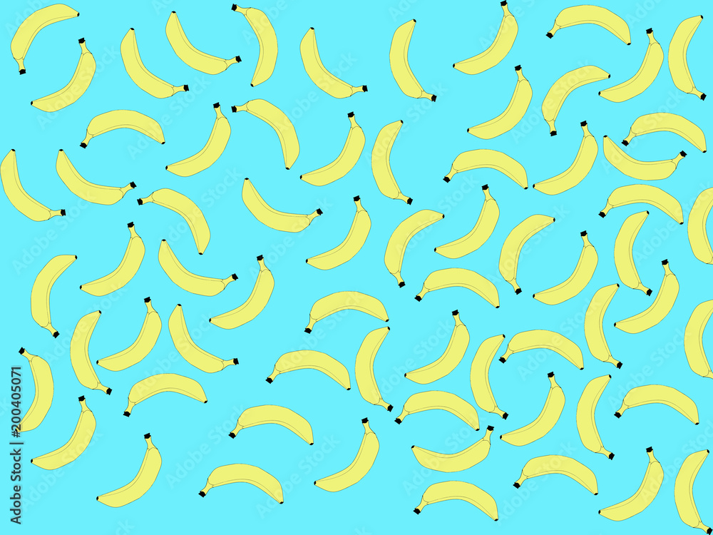 Naklejka premium Yellow bananas are randomly arranged on a blue background