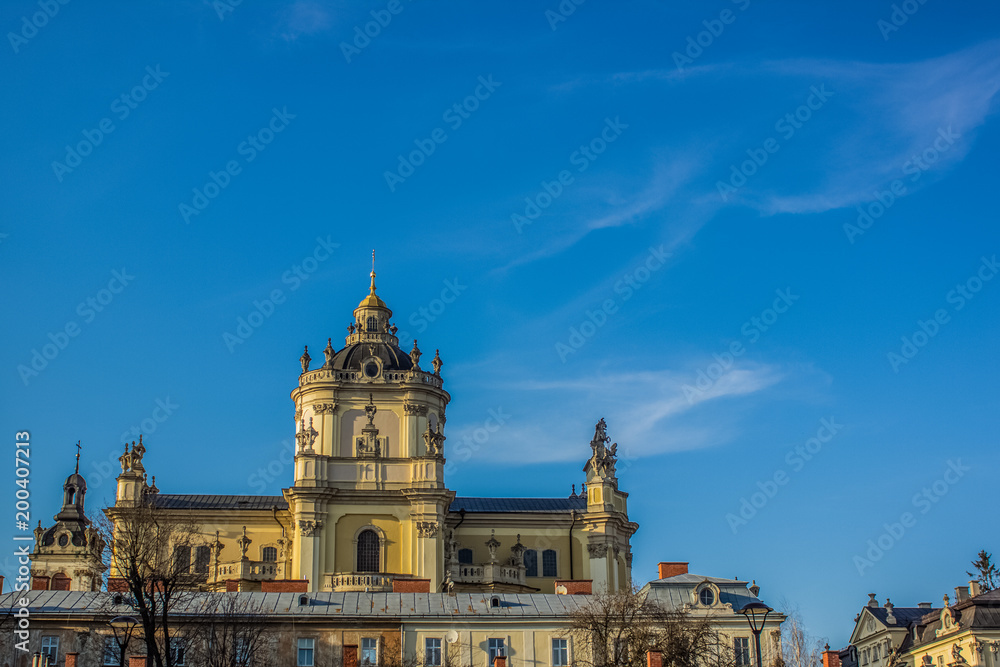 beautiful orthodox church facade in sunset time with empty space on blue sky background