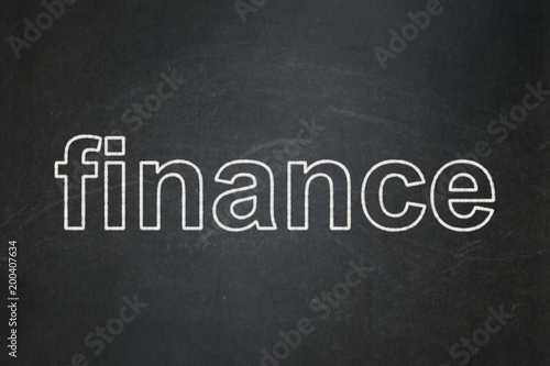 Banking concept: text Finance on Black chalkboard background