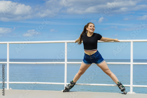 Happy crazy woman wearing roller skates