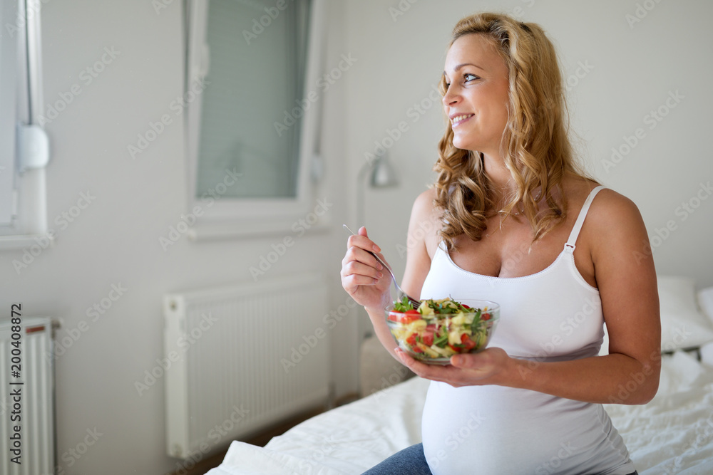 Portrait of pregnant woman eating healthy food Portrait of pregnant woman eating healthy food