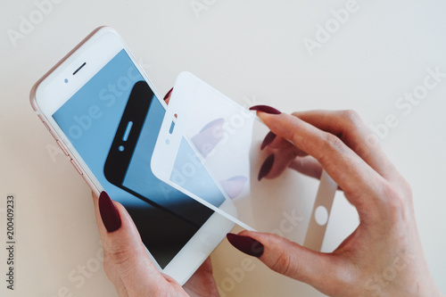 Slika na platnu Smartphone with screen protect glass cover in hands