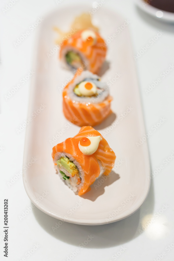 roll sushi with salmon In white plate