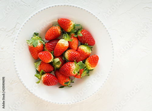  strawberry fresh on the whote plate, top view
