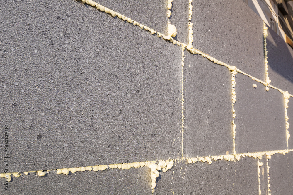 Fototapeta premium Graphite styrofoam insolation on the new house under construction