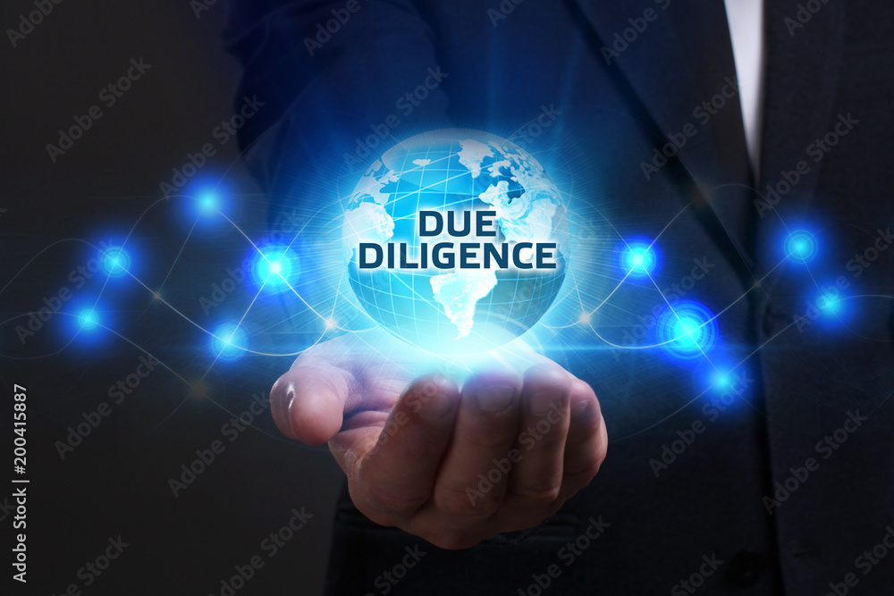 Business, Technology, Internet and network concept. Young businessman working on a virtual screen of the future and sees the inscription: Due diligence Business, Technology, Internet and network concept. Young businessman working on a virtual screen of the future and sees the inscription: Due diligence