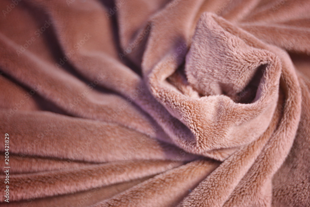 Fototapeta premium Red furry fleece fabric Blanket with a lot of folds relief