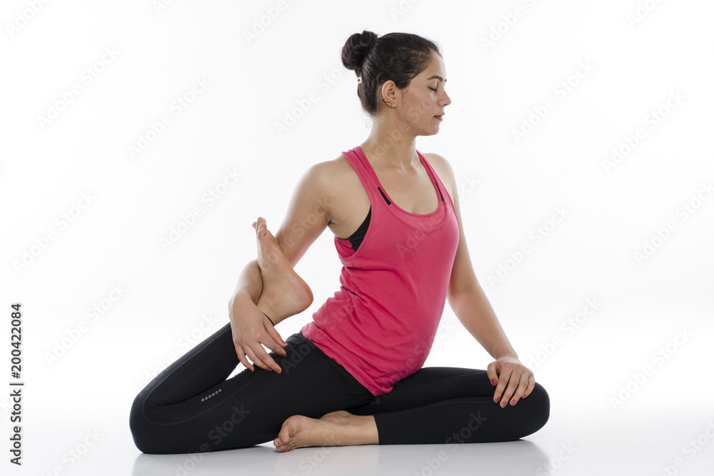 Fototapeta premium Young woman doing yoga, India