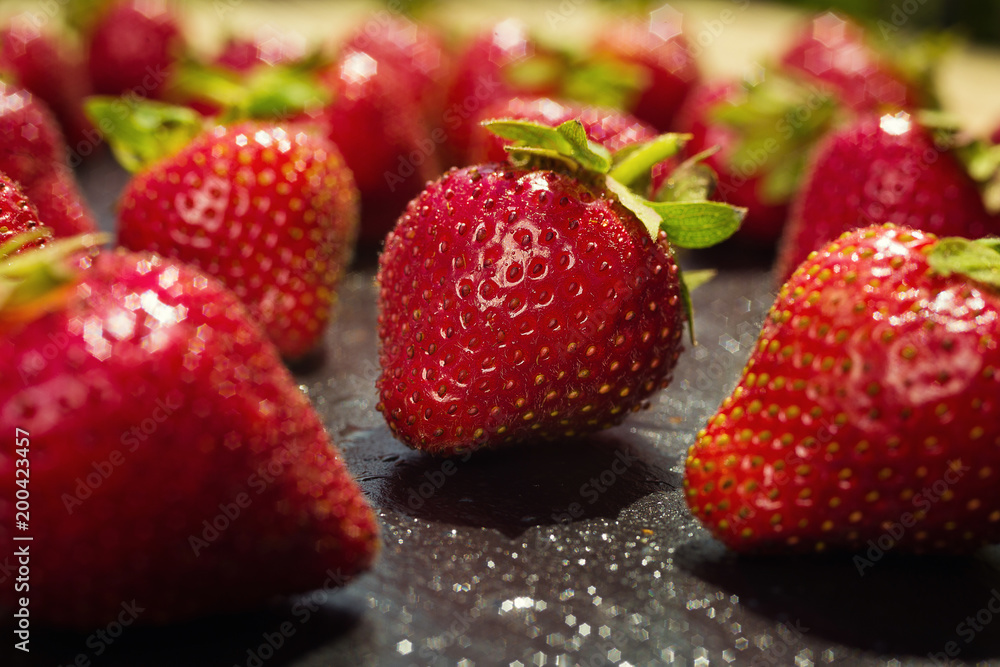 strawberries on stone background, delicious first class organic fruit as a concept of summer vitamins strawberries on stone background, delicious first class organic fruit as a concept of summer vitamins