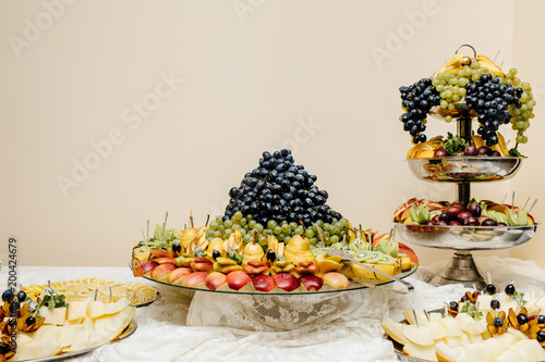 Fototapeta Naklejka Na Ścianę i Meble -  stylish luxury catering for party, decor table of fruits, weddin