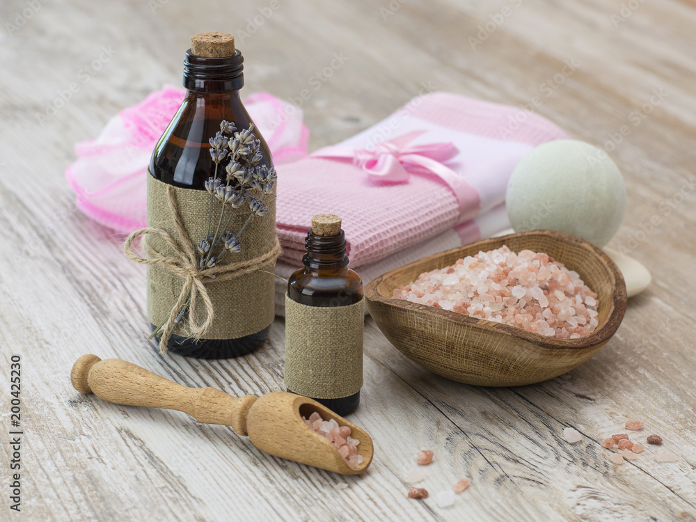 Obraz premium lavender oil on a wooden table.