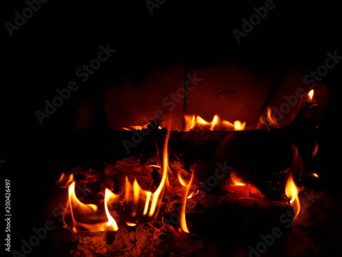 Flames Around a Log in a Fireplace