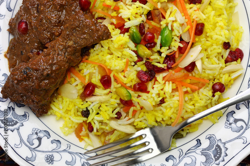 iranian cuisine, persian jeweled rice and chicken fesenjan photo