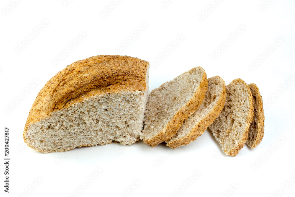 Many mixed breads and rolls of baked bread on isolated white background.