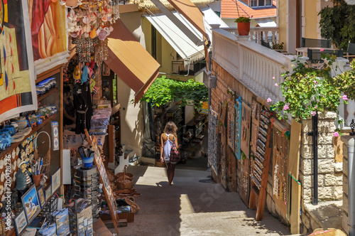 Parga, Epirus - Greece. Narrow alley in the town of Parga, gift shops, souvenirs photo