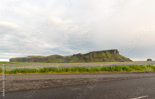 Travel to Iceland. Spectacular Icelandic landscape with road and scenic nature- fjords, fields, clouds. Driving the Ring Road in Southeast Iceland
