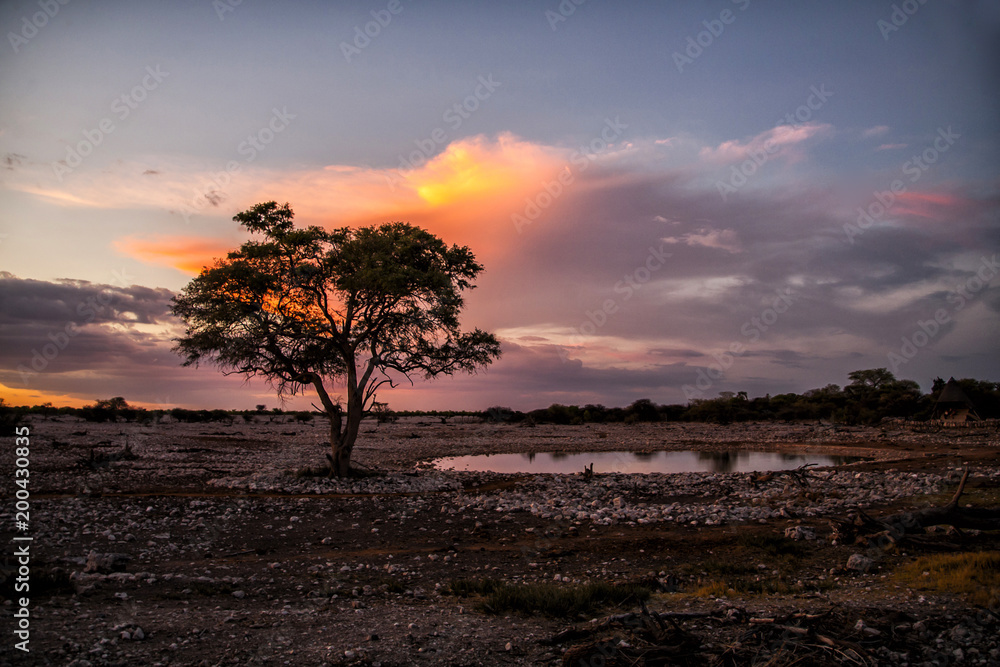 Okaukejo waterhole after sunset in Etosha National Park in Namibia