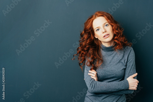 Pretty young redhead woman staring at camera © contrastwerkstatt