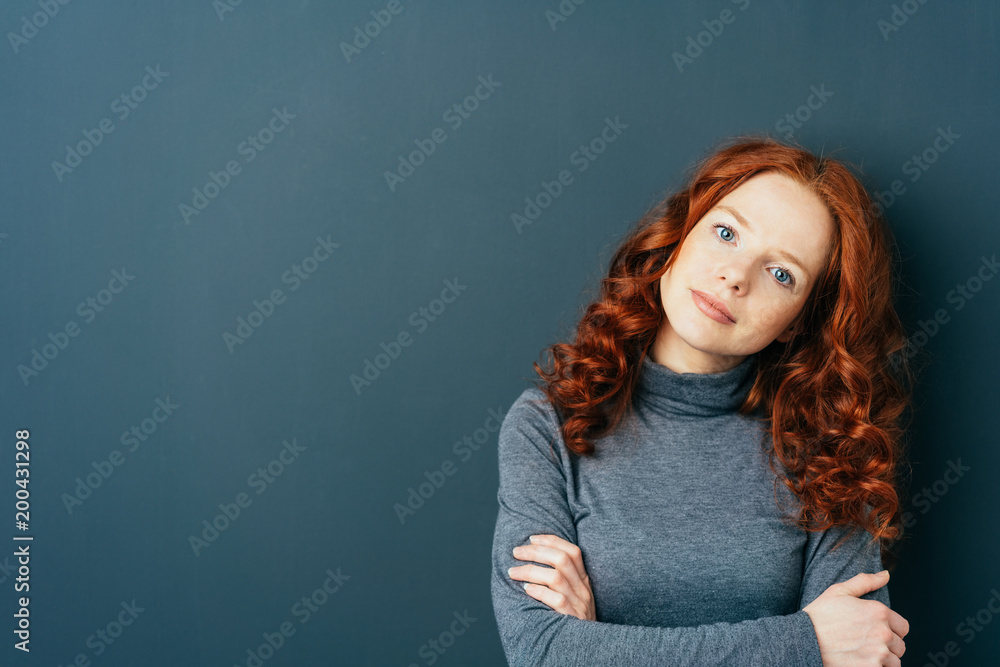 Young cute red-haired woman on dark background Stock-Foto | Adobe Stock