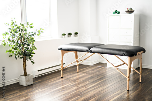 A physiotherapy room with table photo