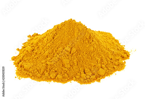 Pile of ground turmeric on a white background