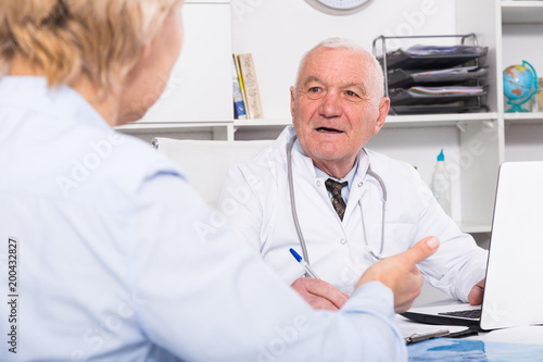 Male doctor with female client