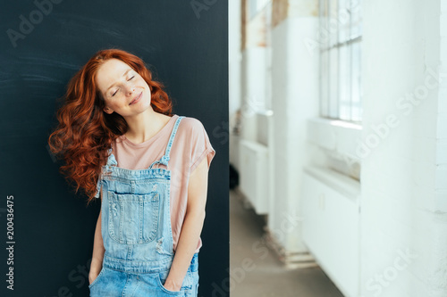 Smiling young woman with a happy serene smile