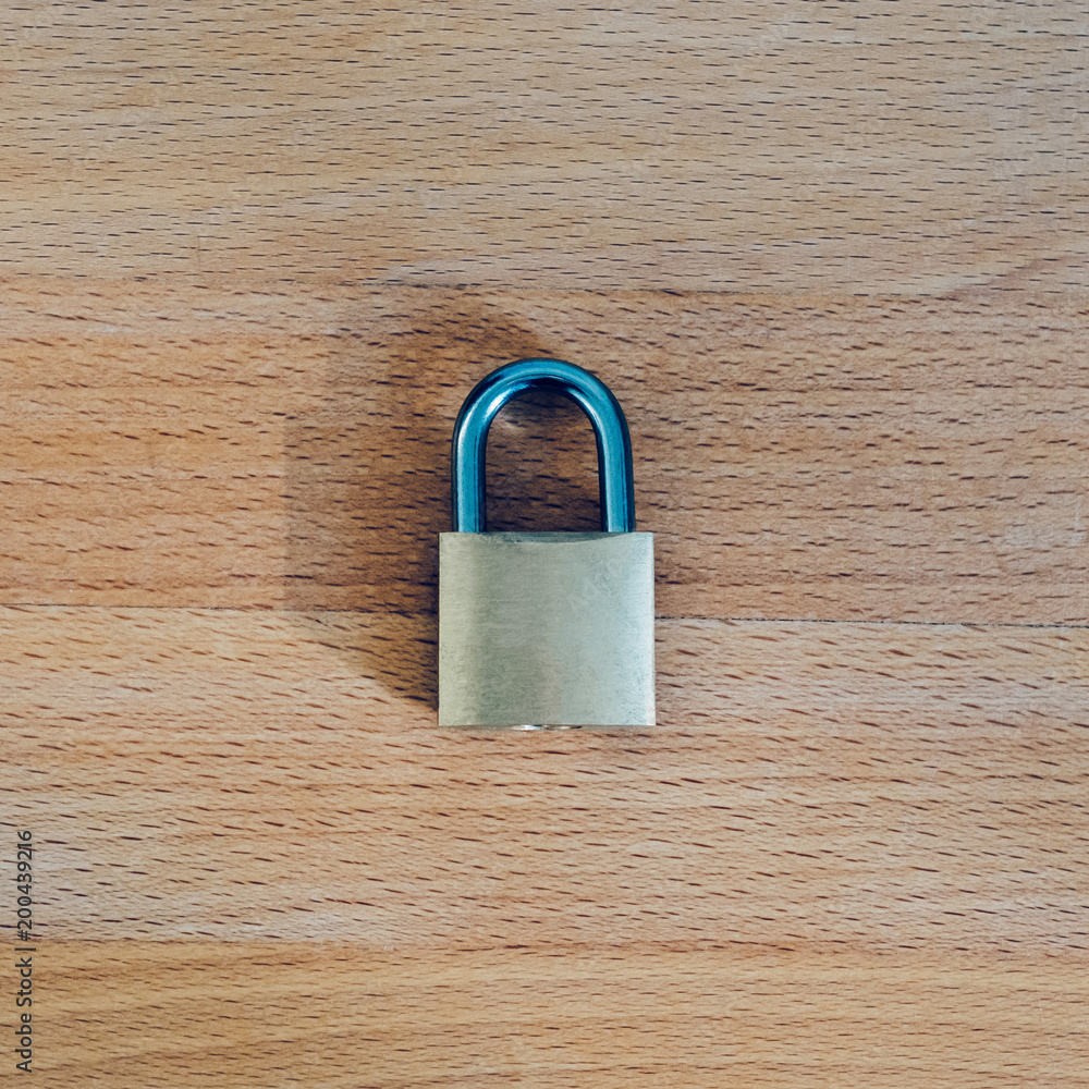 Fototapeta premium lock as symbol for Privacy and General Data Protection Regulation on wooden table
