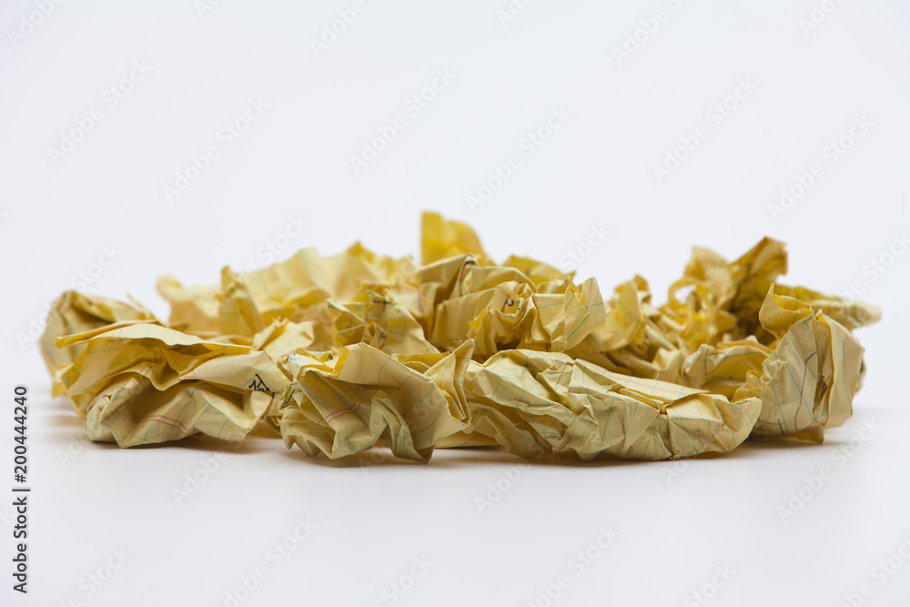 Crumpled yellow papers on white background Crumpled yellow papers on white background