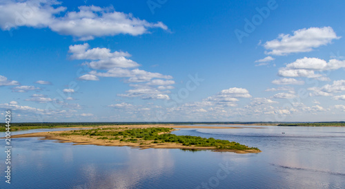 View of the river with clouds reflected in it