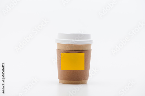 Yellow sticker at take out coffee cup isolated on a white