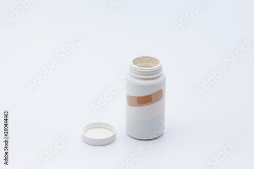Template of a open white can of tablets 