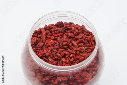  Dried red goji berries in plastic bottle isolated 