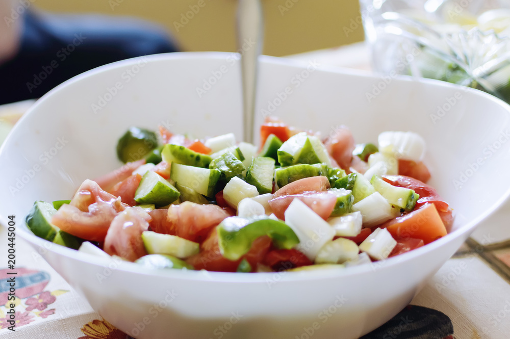 Salad of fresh tomatoes and cucumbers. Homemade natural food. Salad of fresh tomatoes and cucumbers. Homemade natural food.