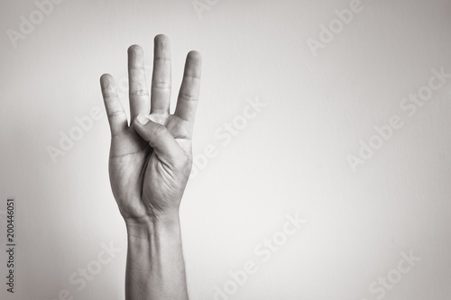 Hand showing five fingers.  photo