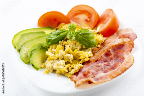 bacon and eggs with avocado and tomato, bread and coffee