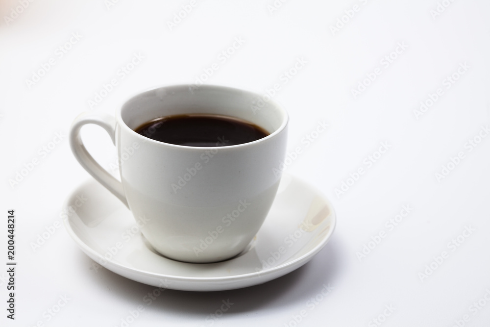 A cup of black coffee on a white A cup of black coffee on a white