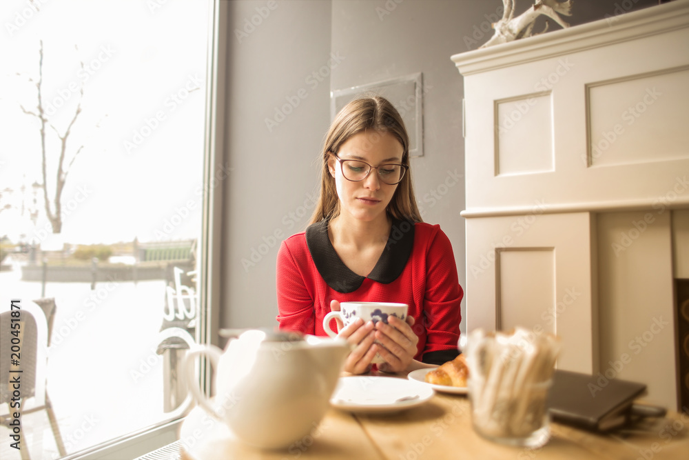 Young woman drinking tea