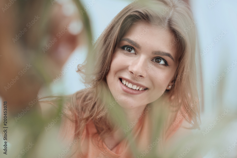 portrait of smiling woman face on blurred background. portrait of smiling woman face on blurred background.